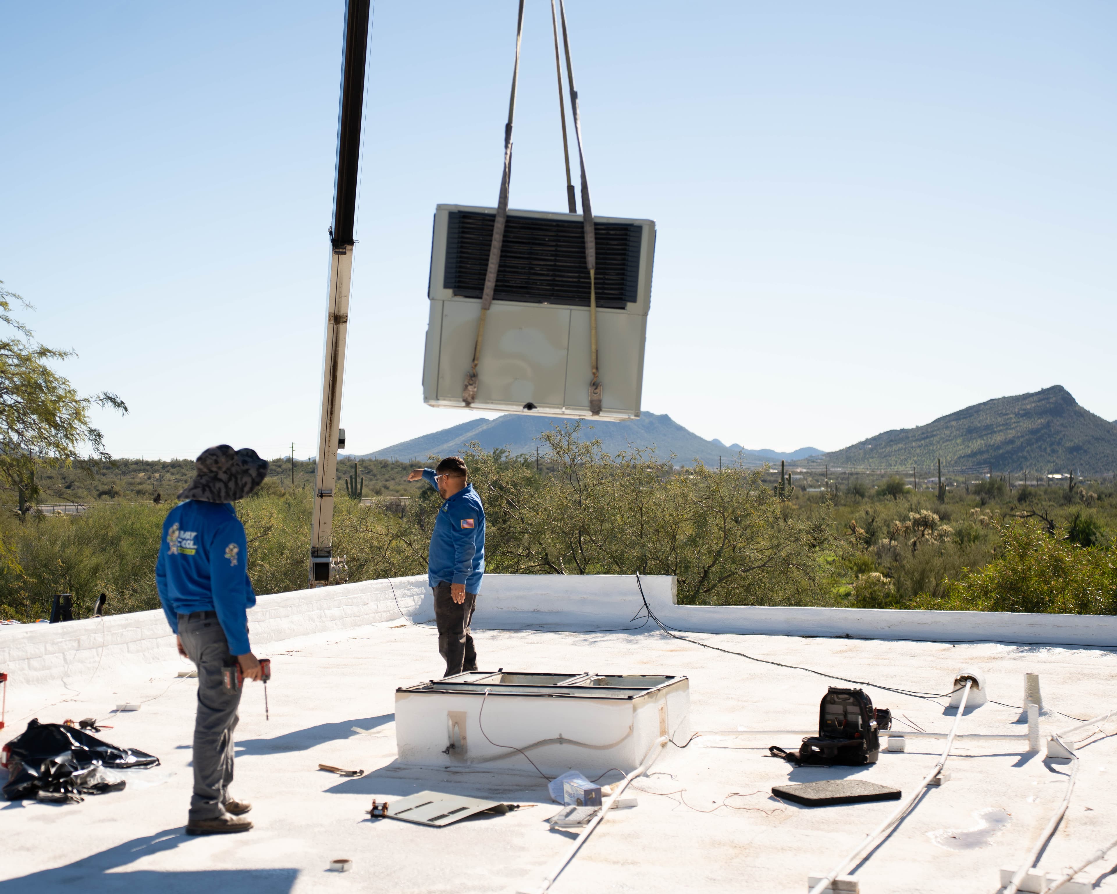 Way Cool craning a package unit onto a Phoenix rooftop
